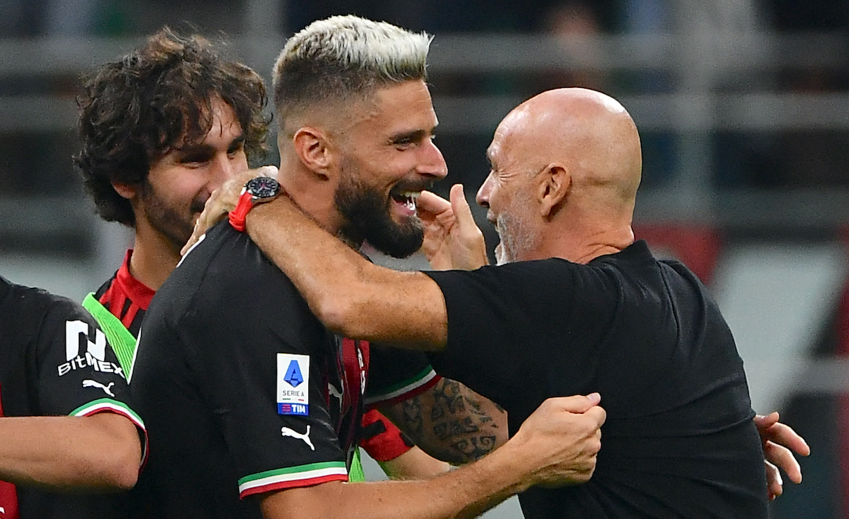 AC Milan's French forward Olivier Giroud (L) and AC Milan's Italian coach Stefano Pioli (R) celebrate the victory after the Italian Serie A football match between AC Milan and Inter Milan at the San Siro stadium in Milan on September 3, 2022. (Photo by Isabella BONOTTO / AFP) (Photo by ISABELLA BONOTTO/AFP via Getty Images)