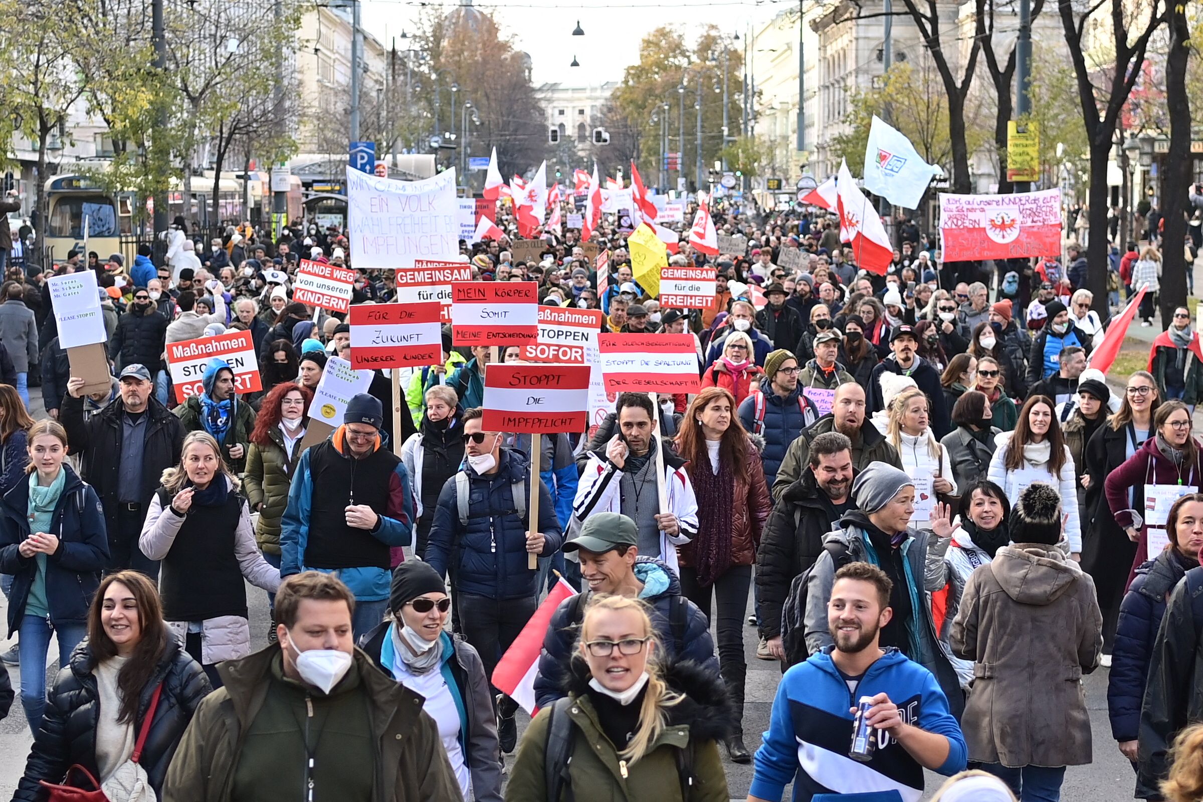 Demonstrators take part in a rally held by Austria's far-right Freedom Party FPOe against the measures taken to curb the coronavirus (Covid-19) pandemic, at Maria Theresien Platz square in Vienna, Austria on November 20, 2021. - Austria will impose a lockdown for all and make vaccinations mandatory, Austria's Chancellor Schallenberg announced on November 19, making the country the first in the EU to take such stringent measures as coronavirus cases spiral. The Alpine nation plans to make Covid-19 vaccinations mandatory from February 1 next year, while the lockdown will start from Monday, November 22 and will be evaluated after 10 days. (Photo by Joe Klamar / AFP) (Photo by JOE KLAMAR/AFP via Getty Images)