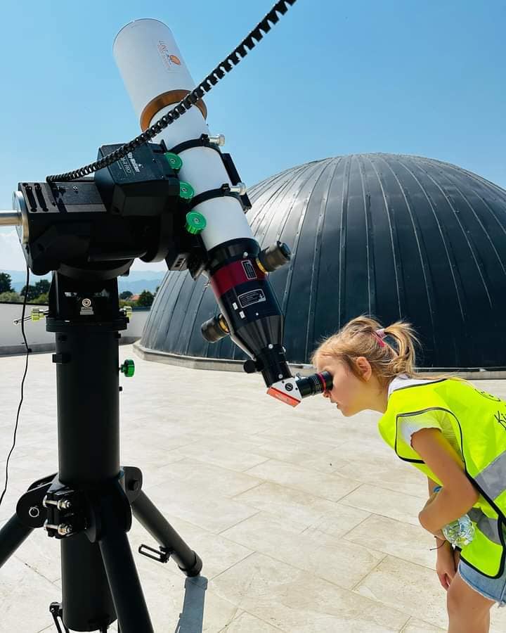 A child looking through a telescope from the observatory space. Photo: Astronomy Outreach of Kosovo.